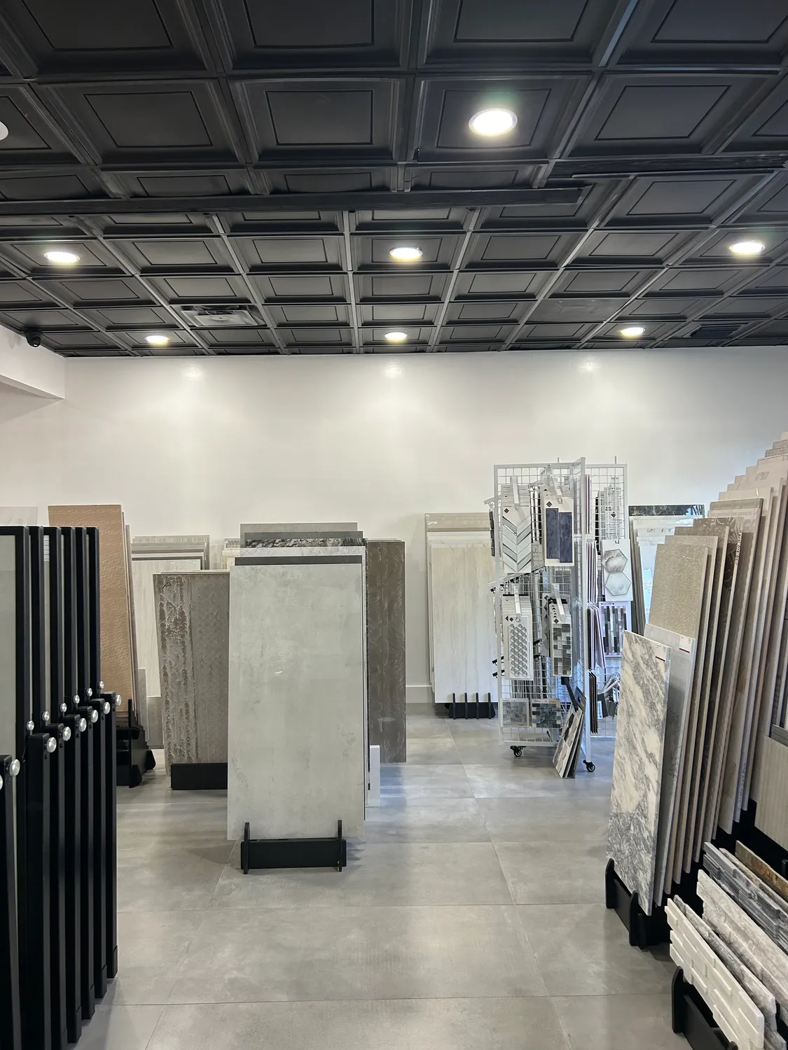 Tile and natural stone displays inside the Vetromani showroom in Pompano Beach