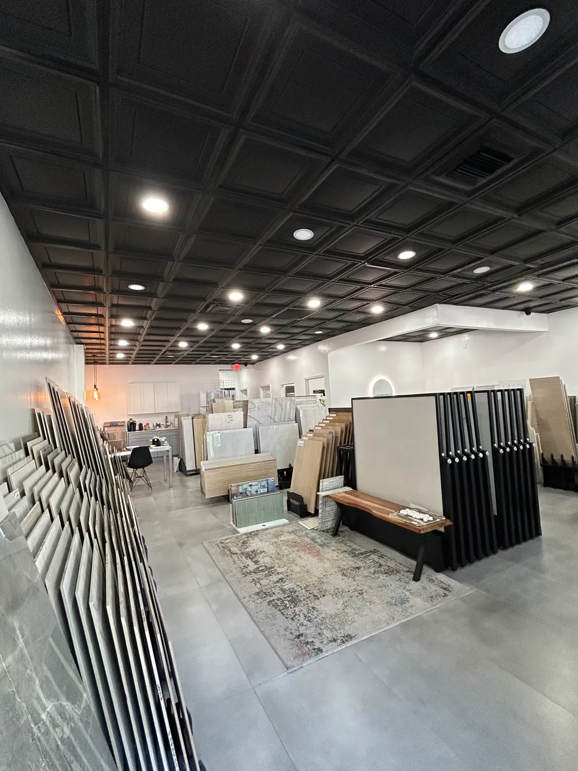 Showroom sample bench with slab racks and material displays