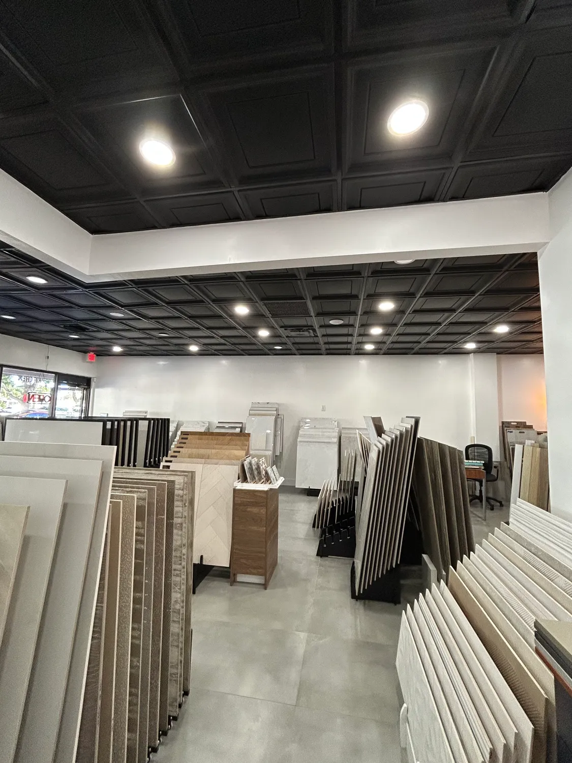 Racks of porcelain and ceramic tile on display in the showroom