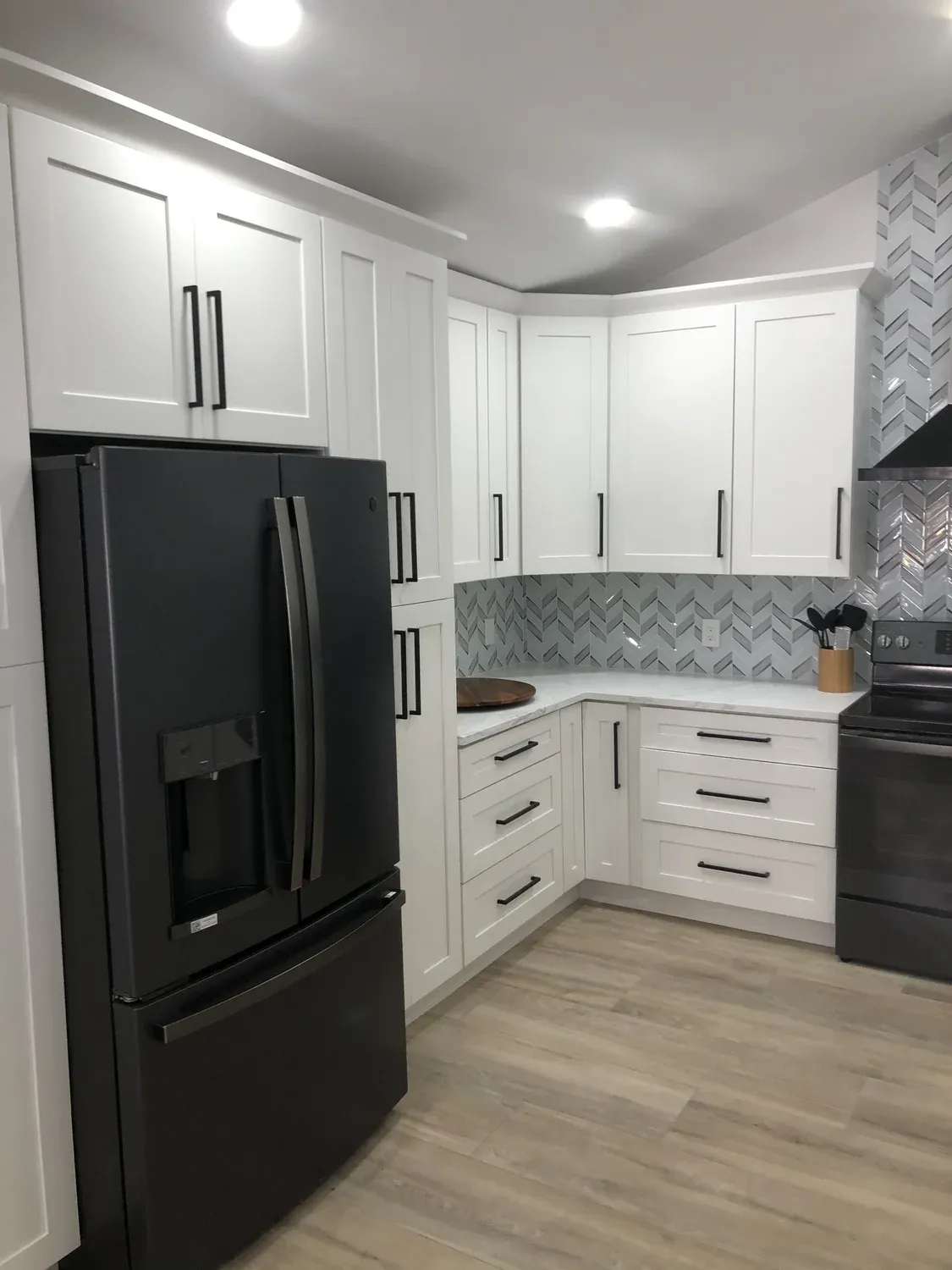 Chevron Tile Kitchen with Black Appliances