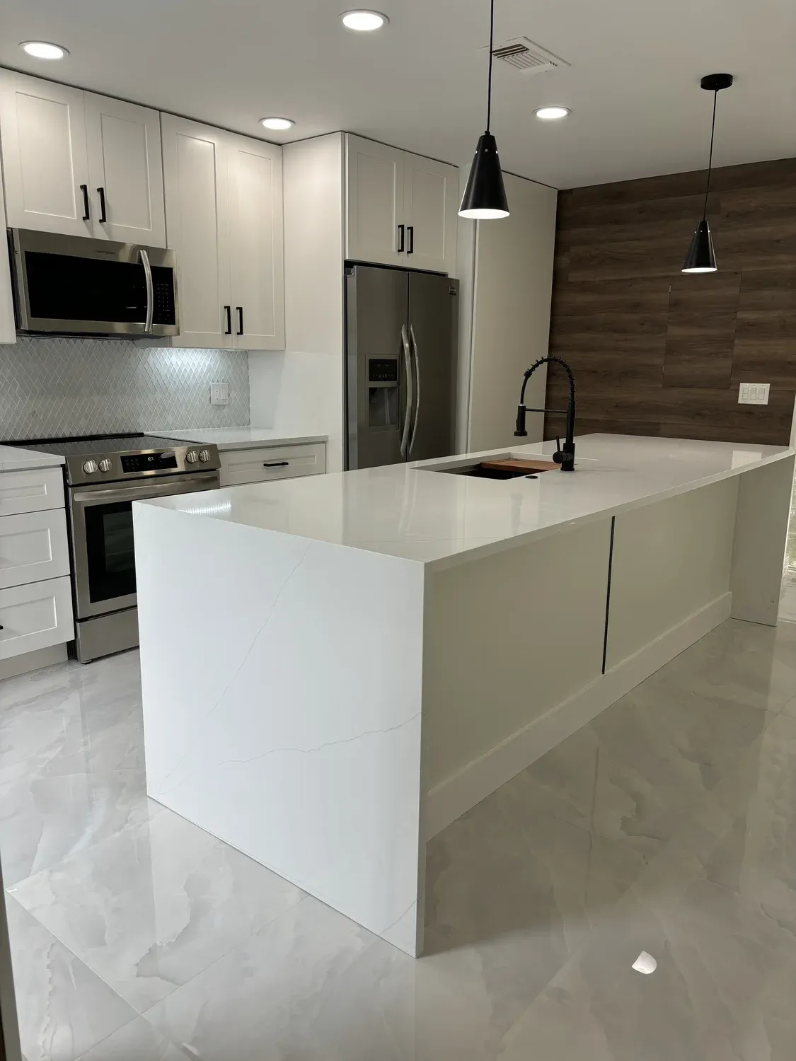 White Kitchen with Wood Accent Wall