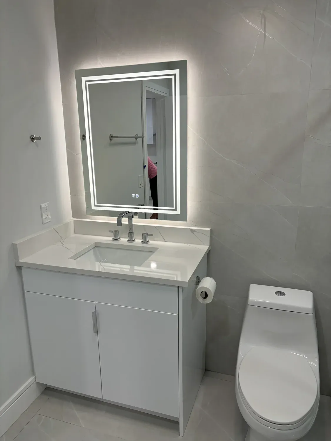 Bathroom with Stacked Laundry Nook