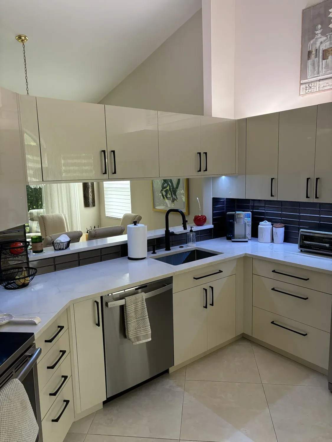 Cream Kitchen with Mirrored Backsplash